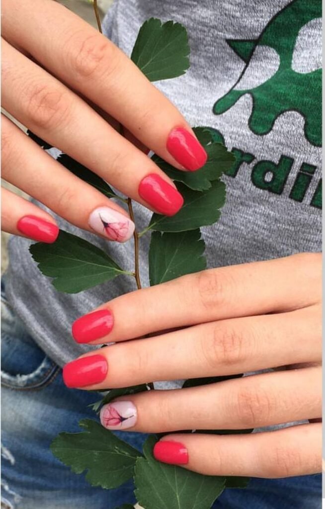 Coral european manicure with delicate accent design in Tampa, Florida at Nail Boss Studio.