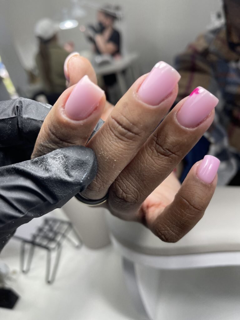 Hard gel russian manicure with soft pink finish and clean cuticles in Tampa Florida.