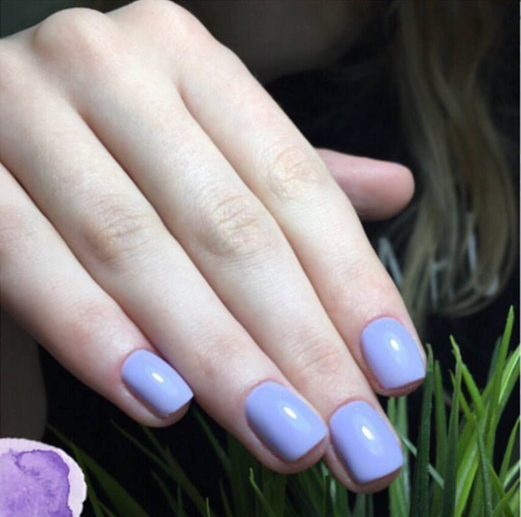 Close-up of soft lilac hard gel russian manicure with clean cuticles in Tampa, Florida.