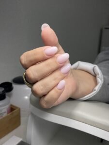 Soft pink russian manicure near me in Tampa, Florida with clean cuticles and natural shine