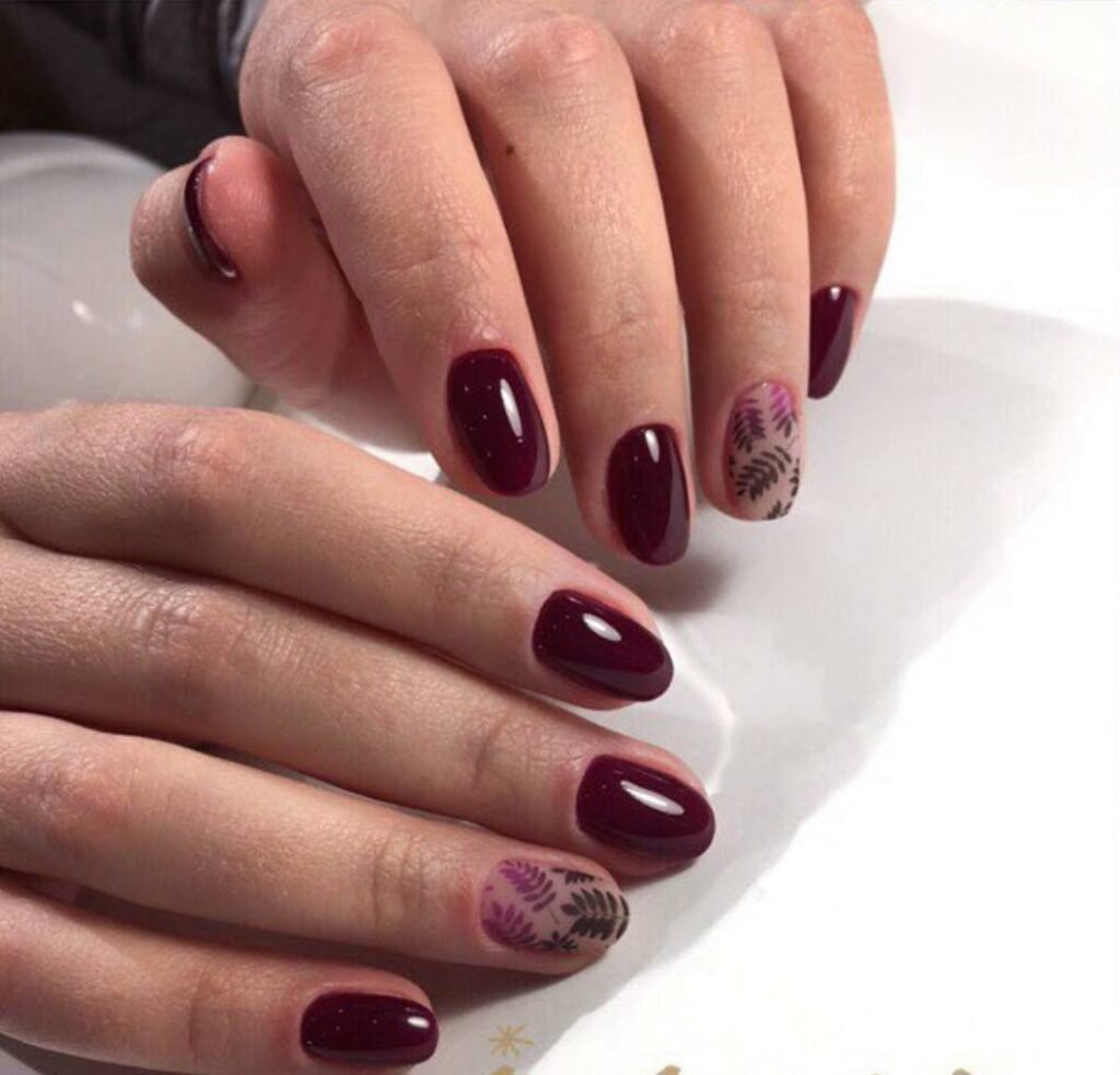 Elegant short nails with deep burgundy finish at a russian manicure salon in Tampa, Florida.