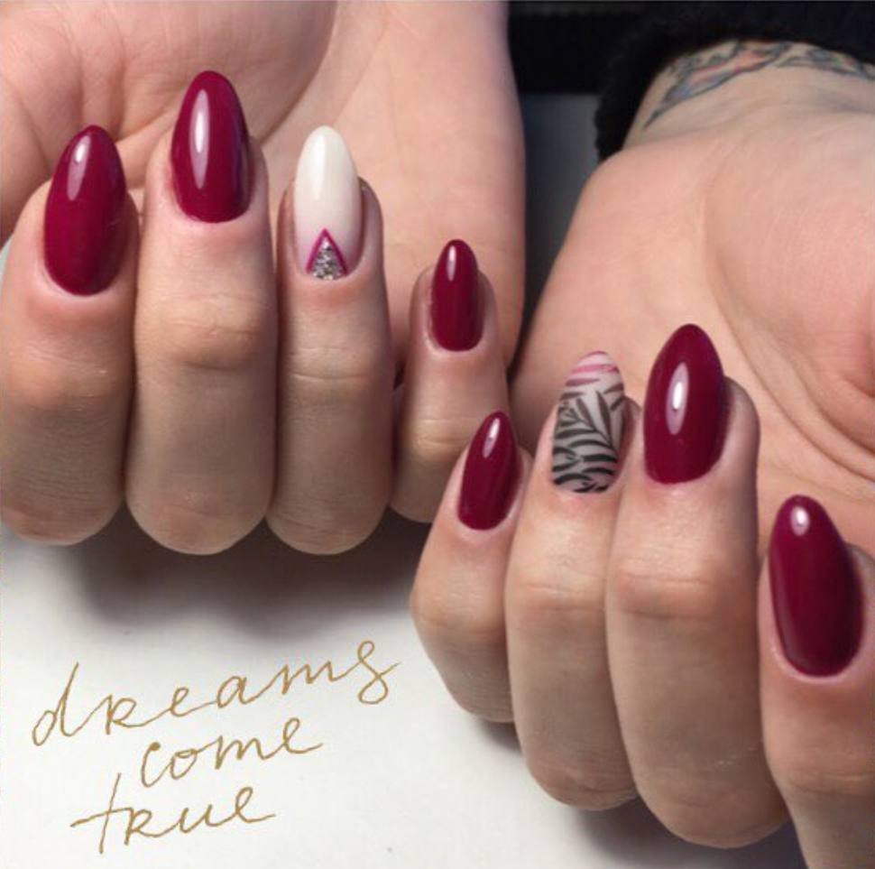 Elegant russian manicure Tampa showcasing deep burgundy nails with refined cuticle work in Florida.