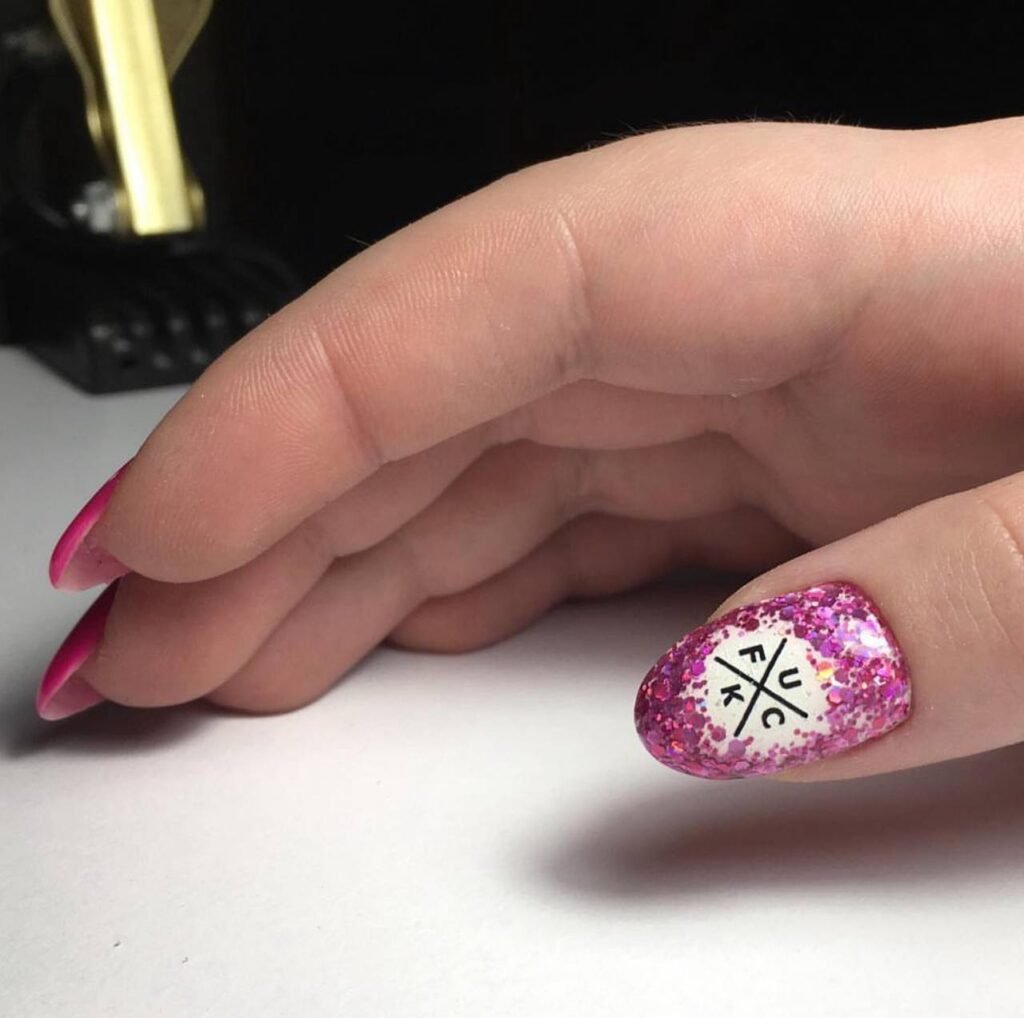 Close-up of pink glitter nails created with russian manicures Tampa technique at Nail Boss Studio in Tampa, Florida.