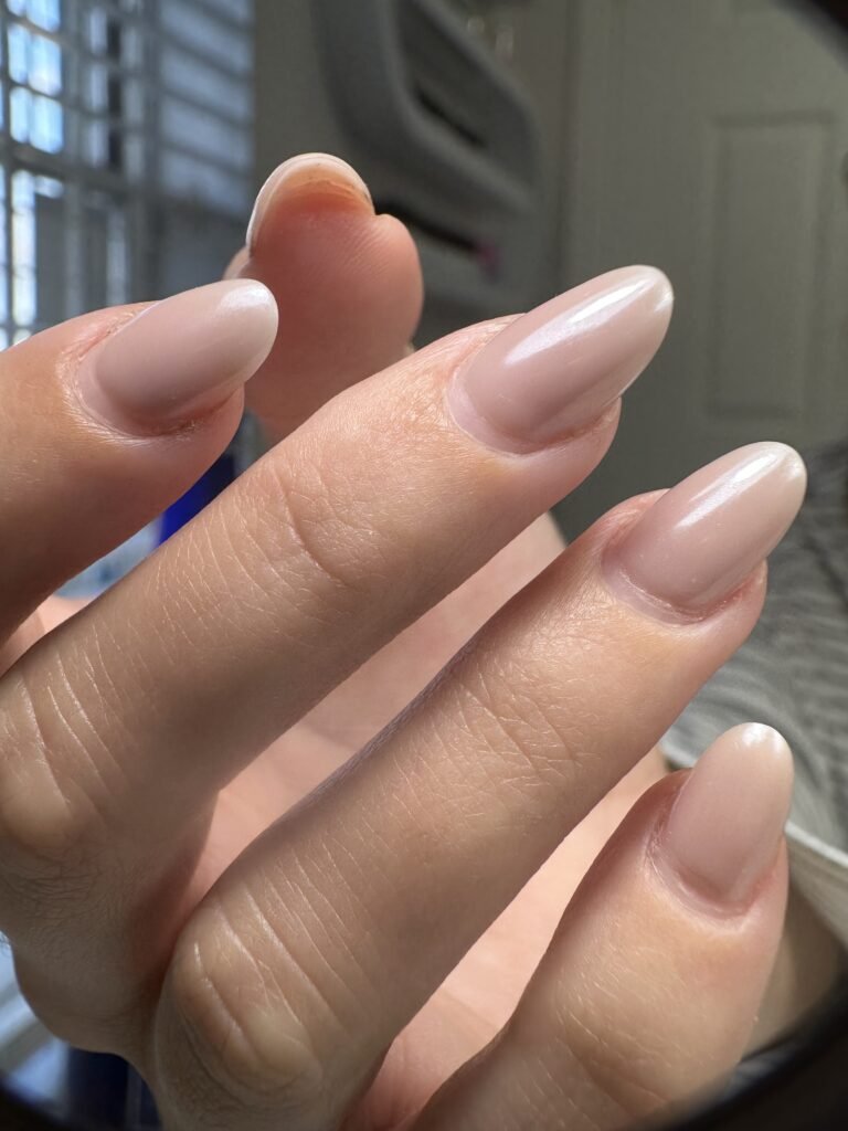 Natural almond-shaped nails created at a russian nail salon in Tampa, Florida with clean cuticle work