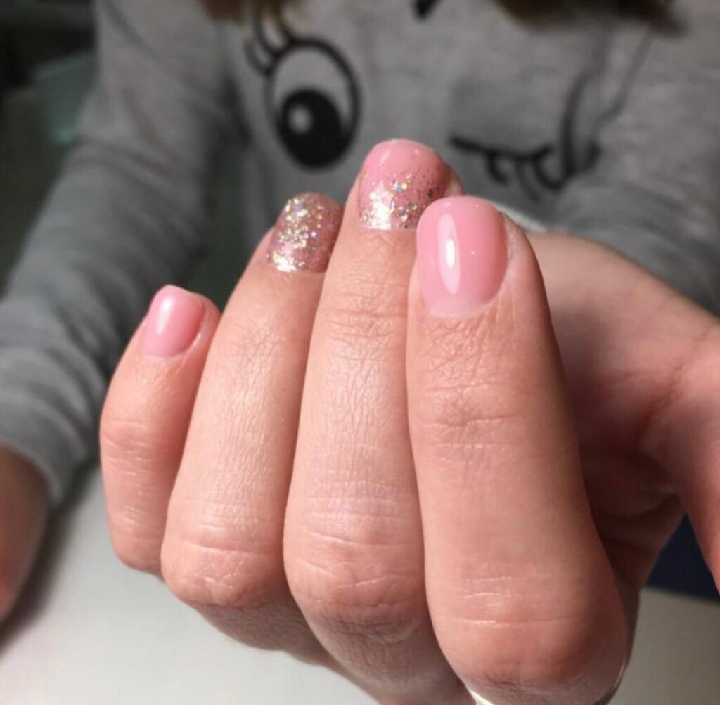 Soft pink manicure with delicate shimmer at a russian nail salon in Tampa, Florida
