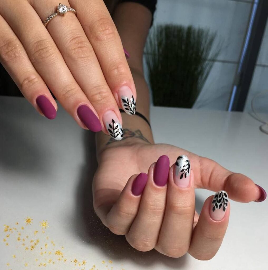 Matte plum russian nails with black botanical accents in Tampa Florida at Nail Boss Studio