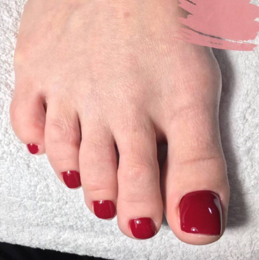 Close-up red gel russian pedicure tampa at Nail Boss Studio in Tampa, Florida