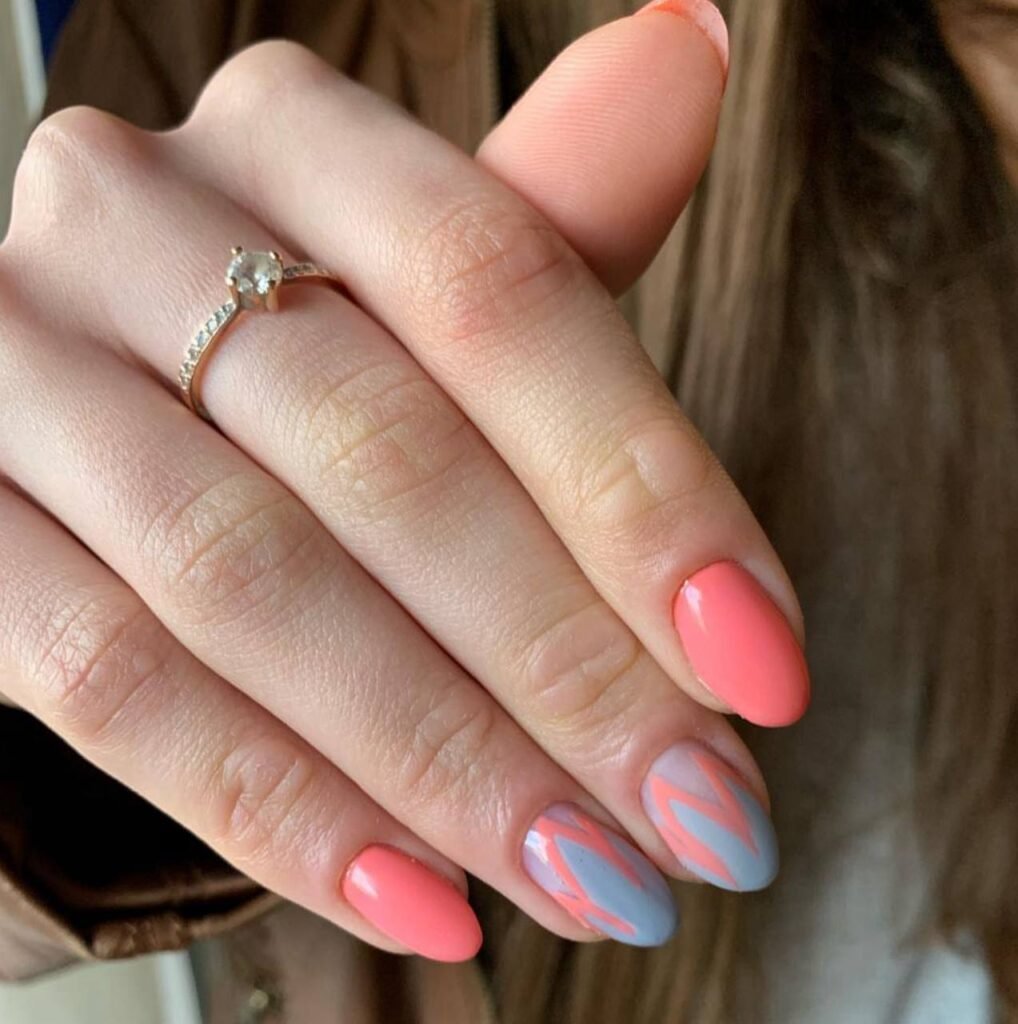 Soft coral hard gel russian manicure in Tampa, Florida with structured almond shape and glossy finish.