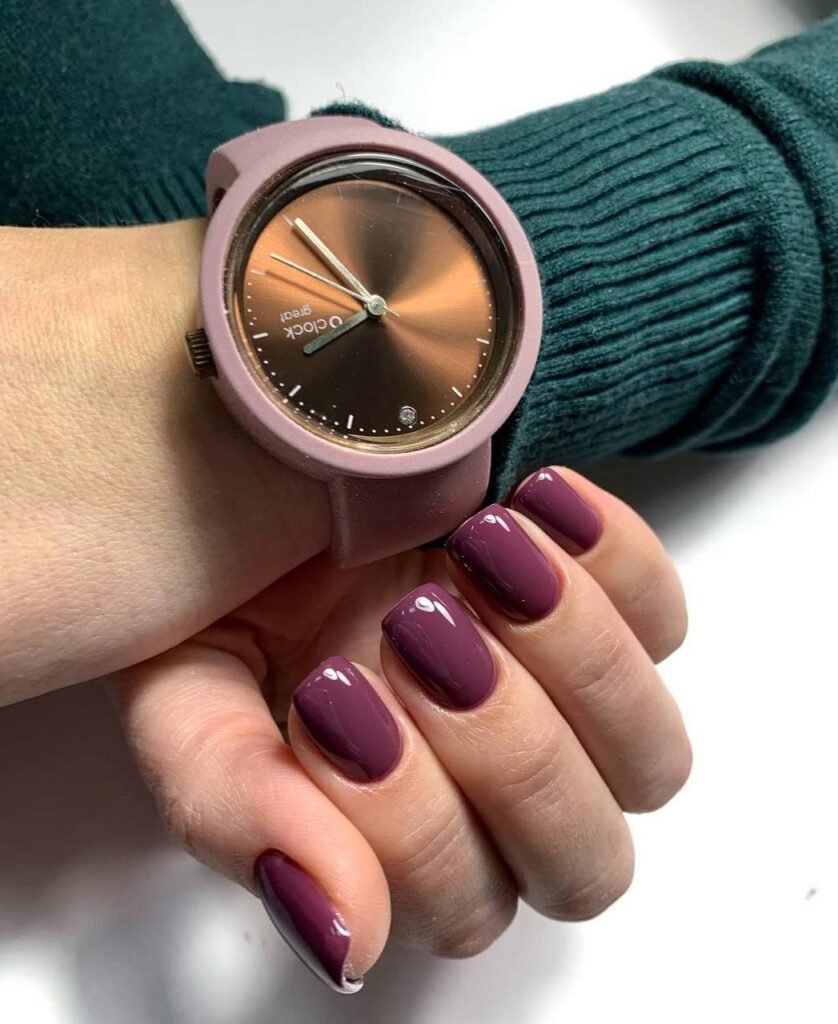 Deep plum glossy hard gel russian manicure on short nails in Tampa Florida with clean cuticle work