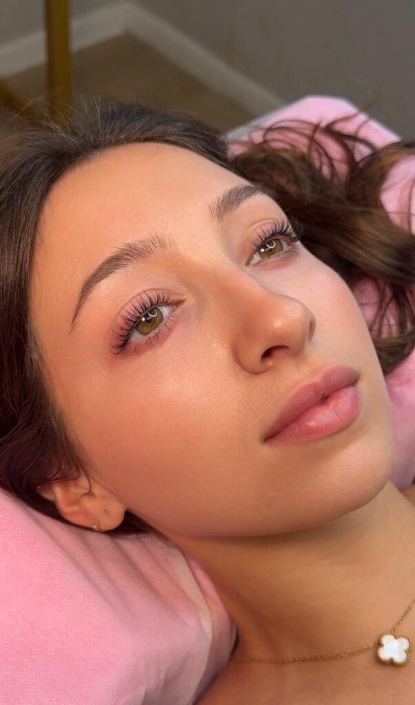 Close-up of model after lash lift and tint showing natural lifted and darkened lashes