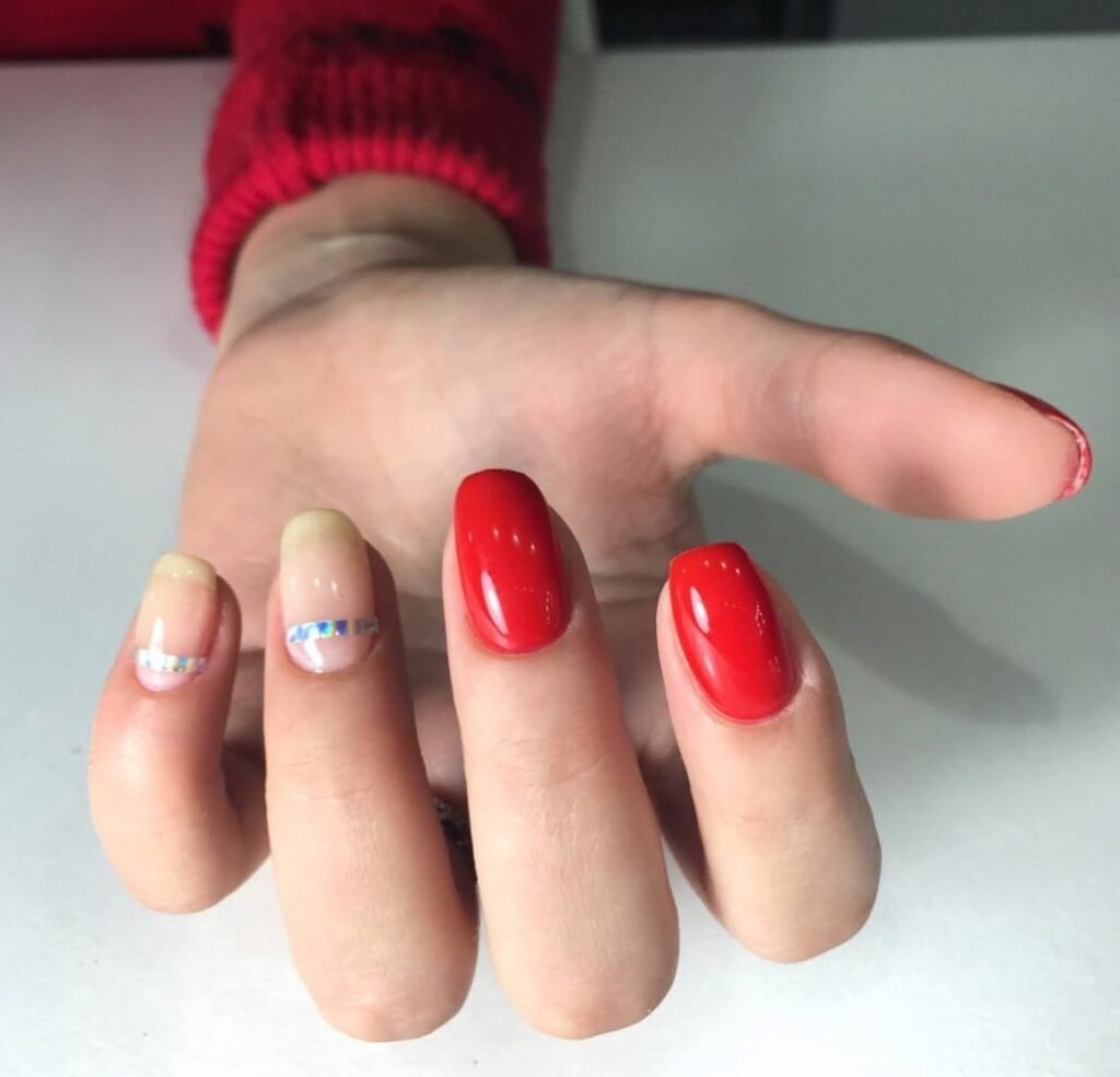 Fresh glossy red nails with minimalist design created with russian manicure in Tampa at Nail Boss Studio