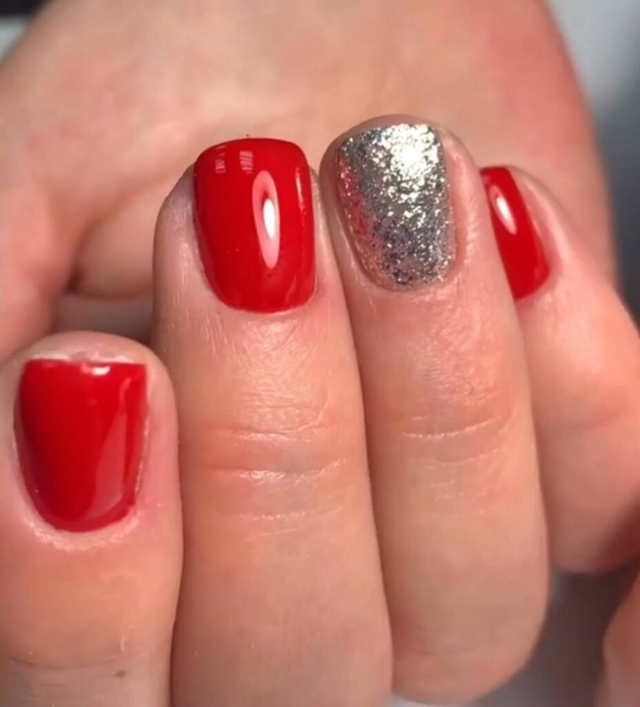 Glossy red manicure with silver accent created with russian manicures near me in Tampa Florida