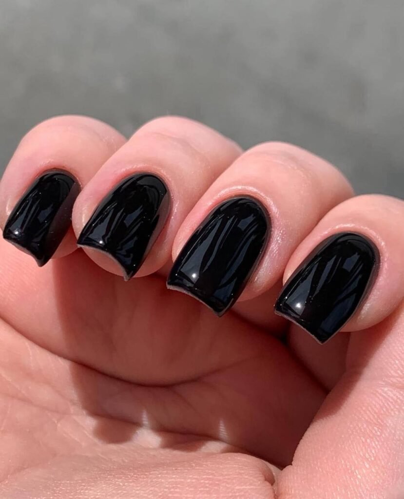 Short glossy black nails created with russian manicures Tampa in Tampa Florida