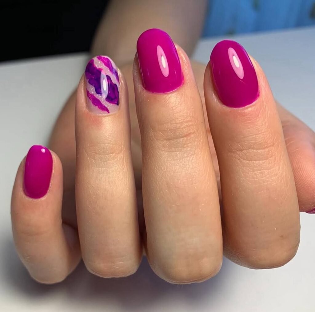 Bright pink glossy manicure with abstract accent design at russian nail salon near me in Tampa, Florida.