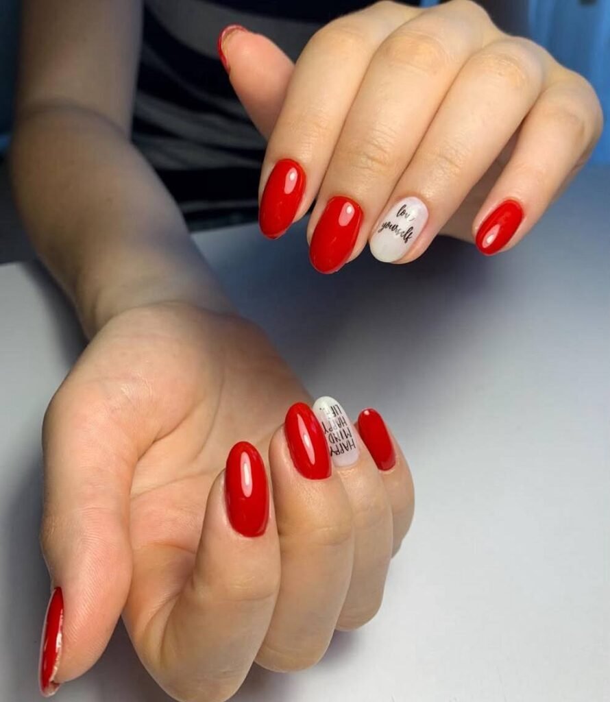 Elegant red manicure with accent nail created at a russian nail salon near me in Tampa Florida.