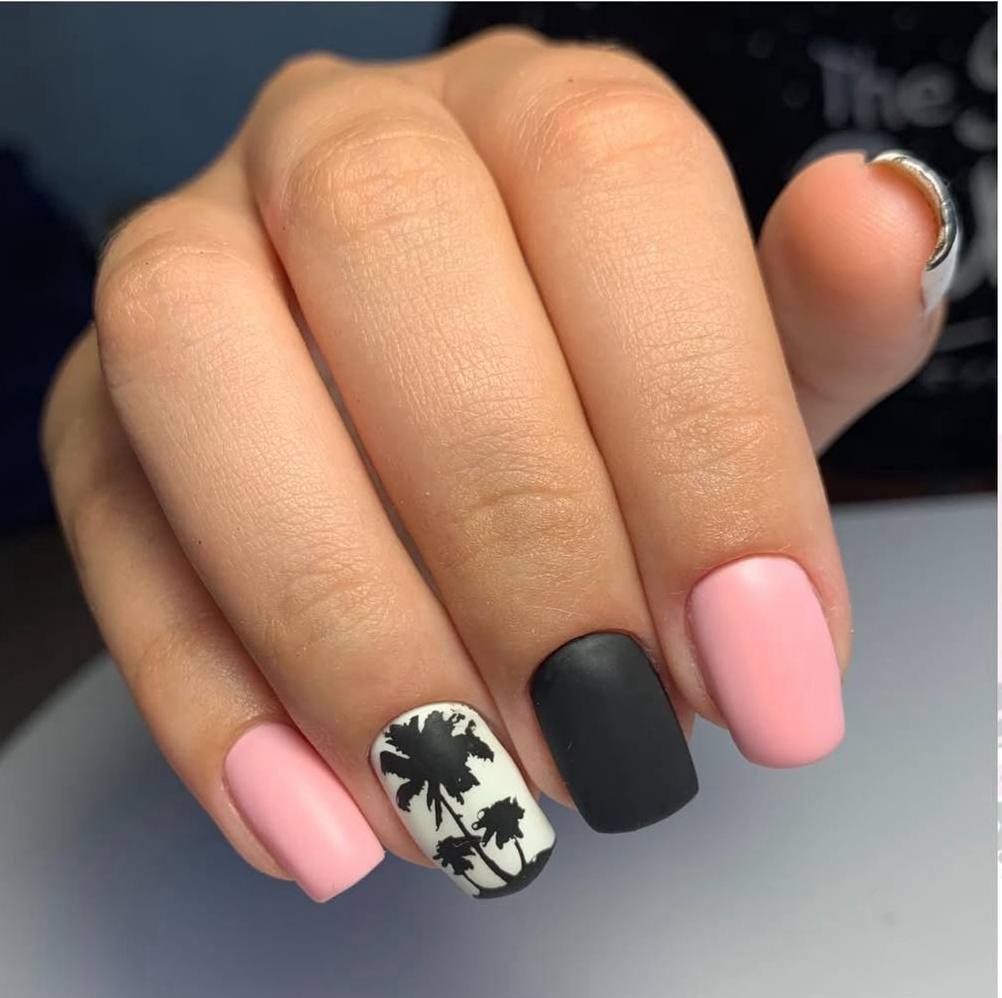 Matte pink and black manicure with botanical design created using russian Nails Tampa technique in Tampa Florida.