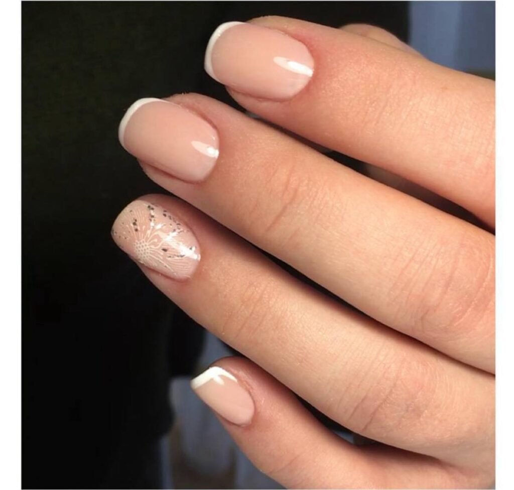 Soft nude french manicure with delicate accent design, russian nails Tampa style at Nail Boss Studio in Tampa, Florida.