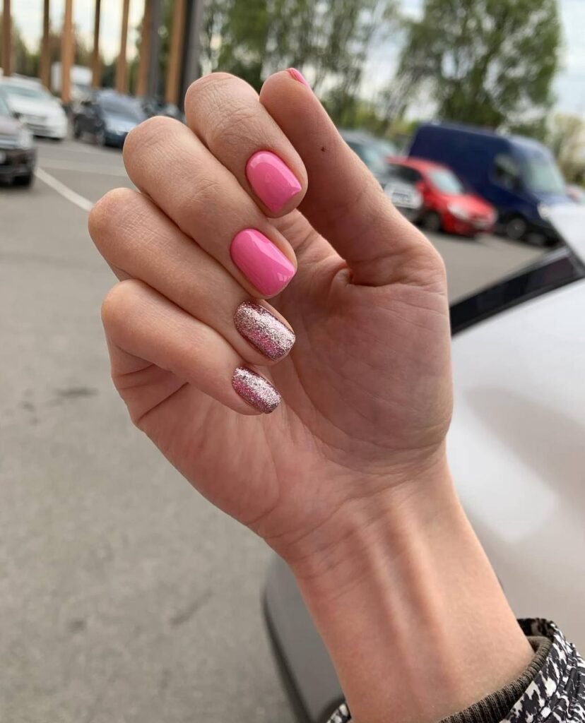 Soft pink european manicure with glossy finish and glitter accent nails in Tampa