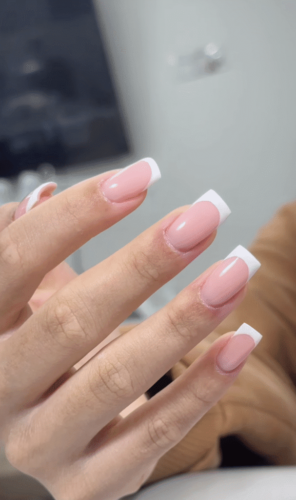 Soft pink french nails with builder gel manicure near me in Tampa Florida clean glossy finish