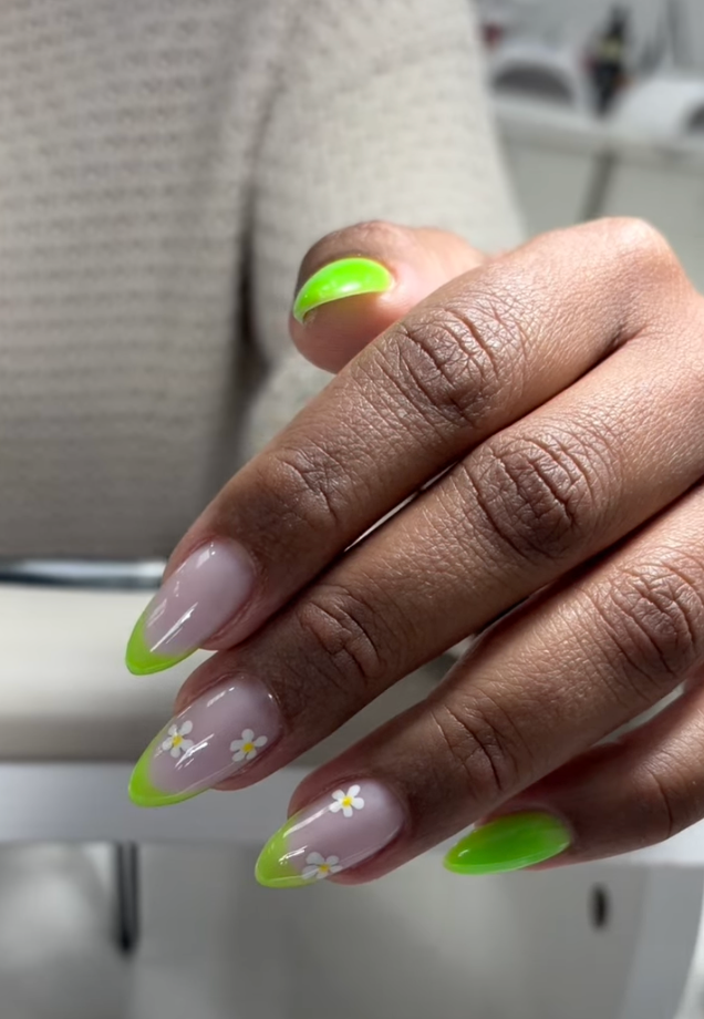 Builder gel manicure near me in Tampa with neon green French tips and delicate floral nail art