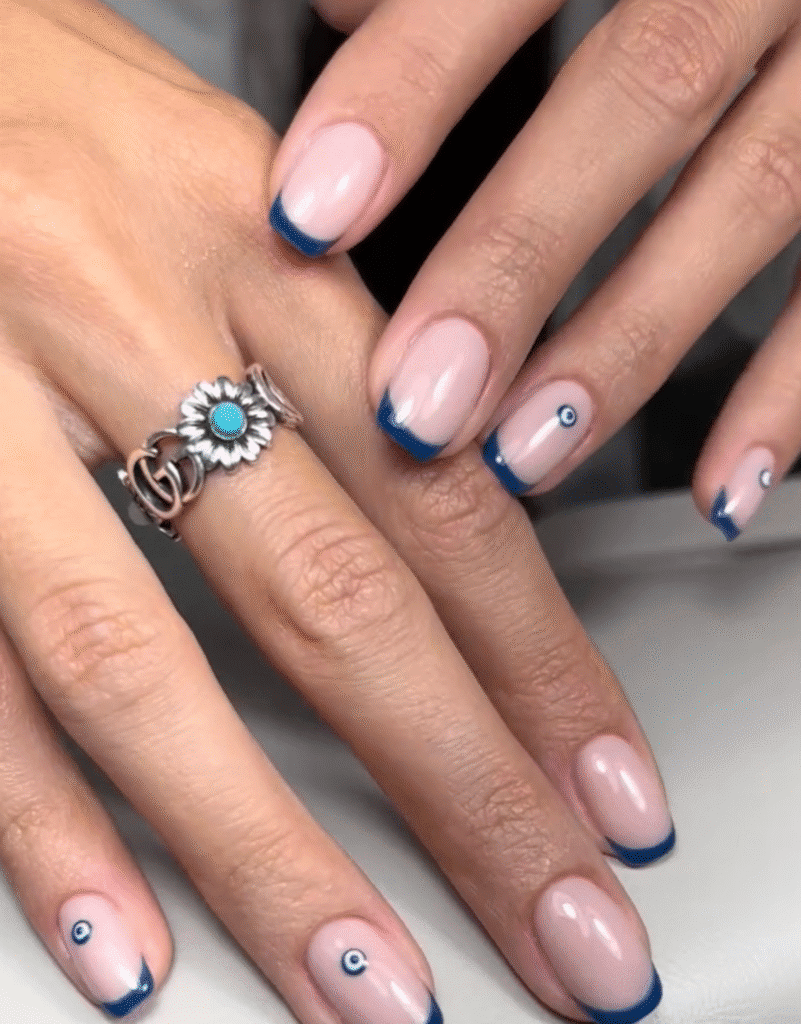 Elegant nude nails with blue French tips and minimal design builder gel manicure Tampa Florida