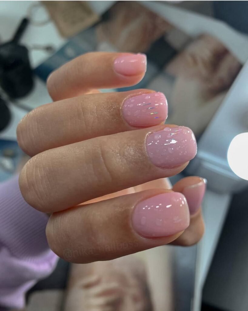 Soft pink builder gel manicure Tampa nails with glossy finish and perfect shape in Tampa Florida