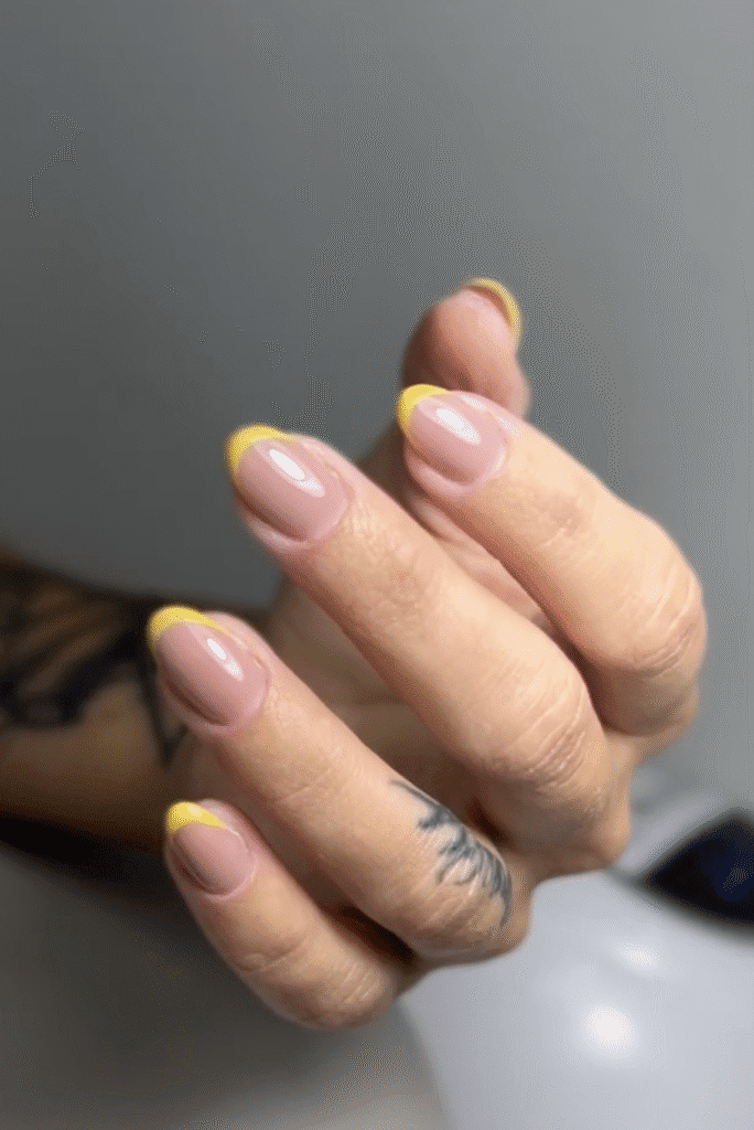 Elegant builder gel Tampa manicure with pink shimmer nails and butterfly nail art in Tampa Florida