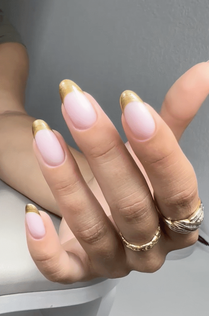 Elegant dry manicure with gold French tips on natural nails in Tampa, Florida