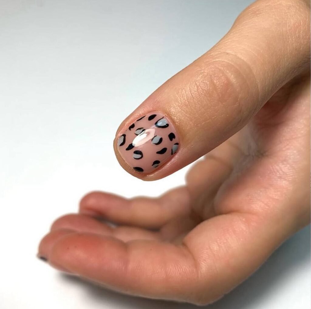 european manicure in Tampa with nude base and leopard nail design close-up