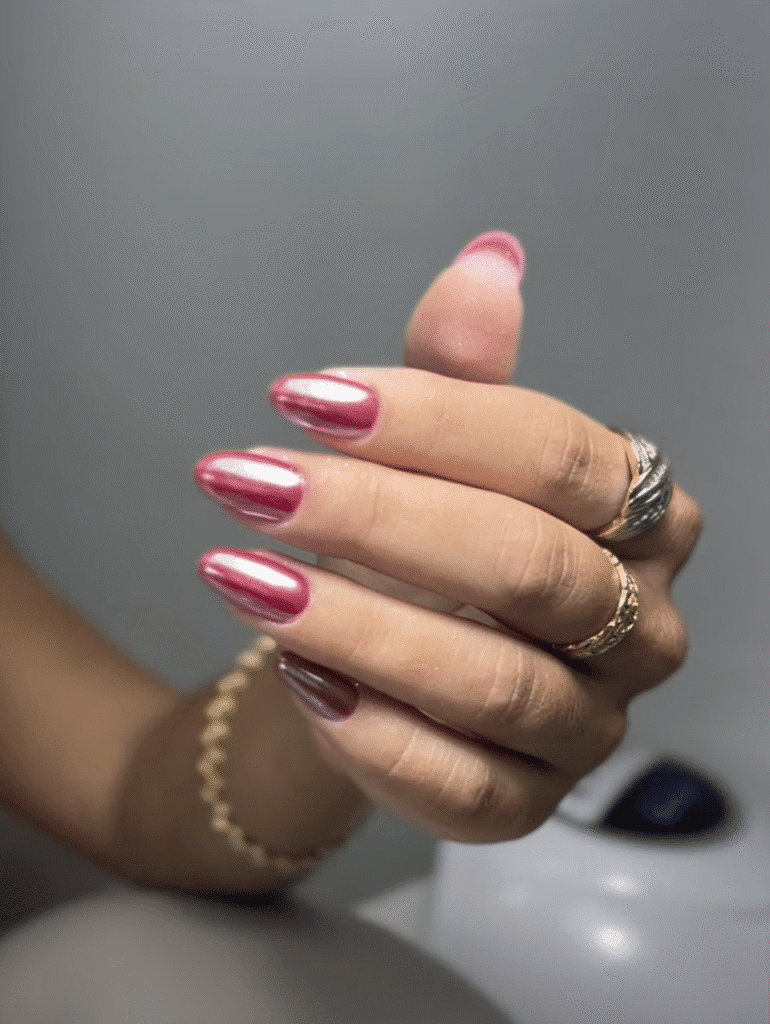 Elegant pink chrome nails with russian manicure in Tampa, Florida showcasing perfect shape and glossy finish