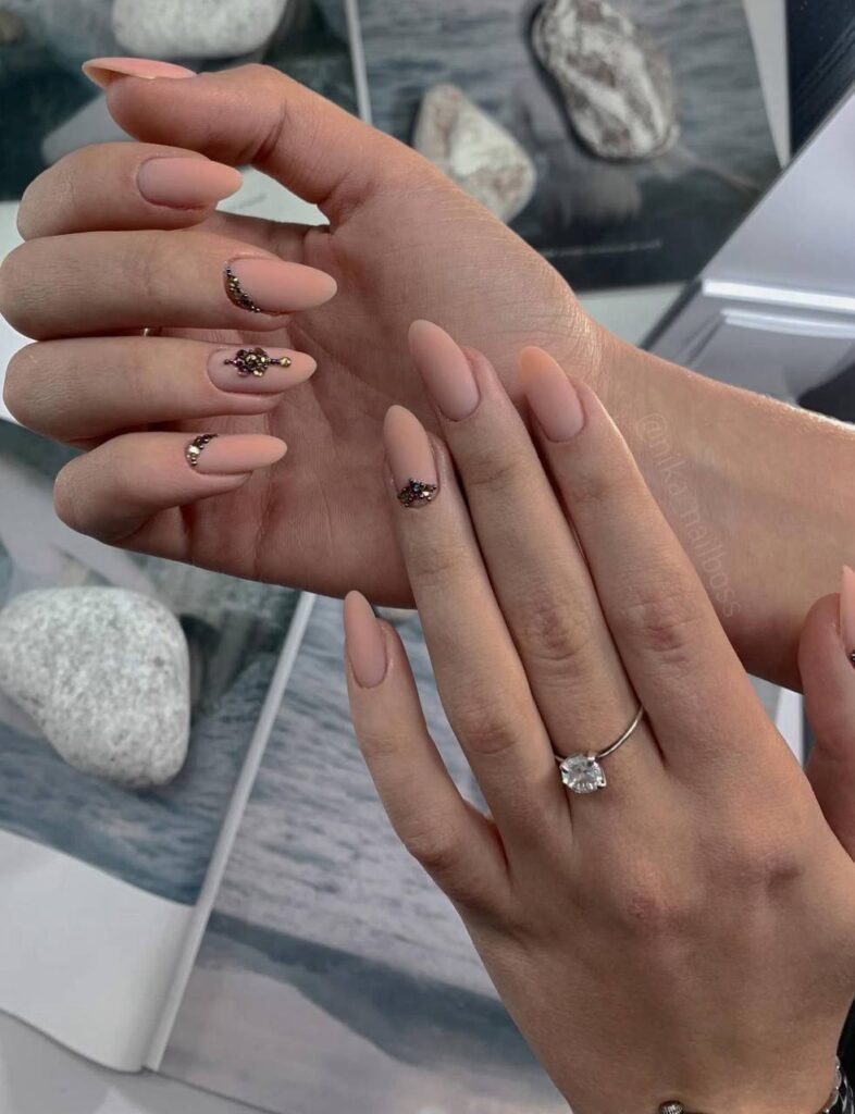 Elegant nude almond nails with crystals created with russian manicure in tampa, Florida