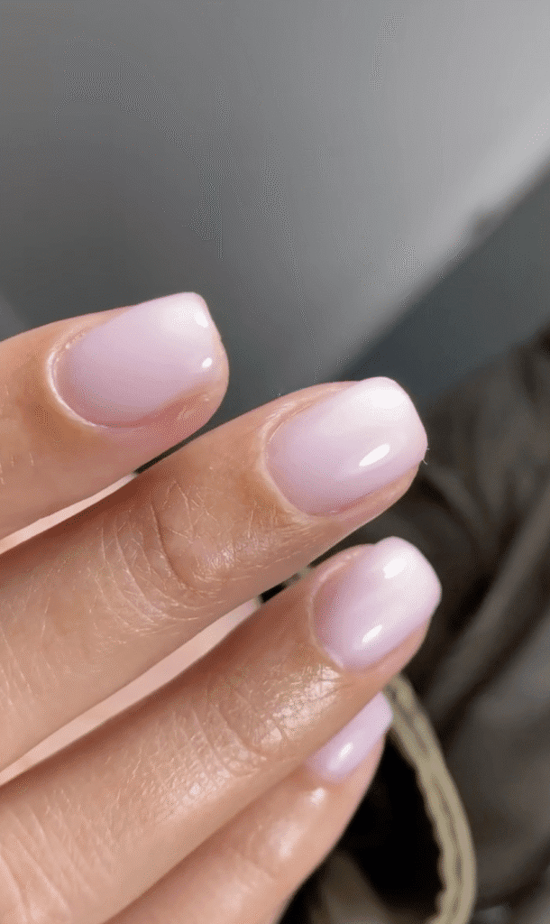 Soft pink glossy nails after russian manicure near me in Tampa, Florida with clean cuticle work