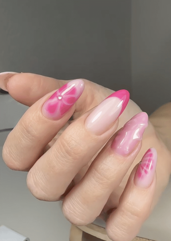 Elegant pink gradient nail design from a russian manicure salon in Tampa, Florida with glossy finish and precise cuticle work