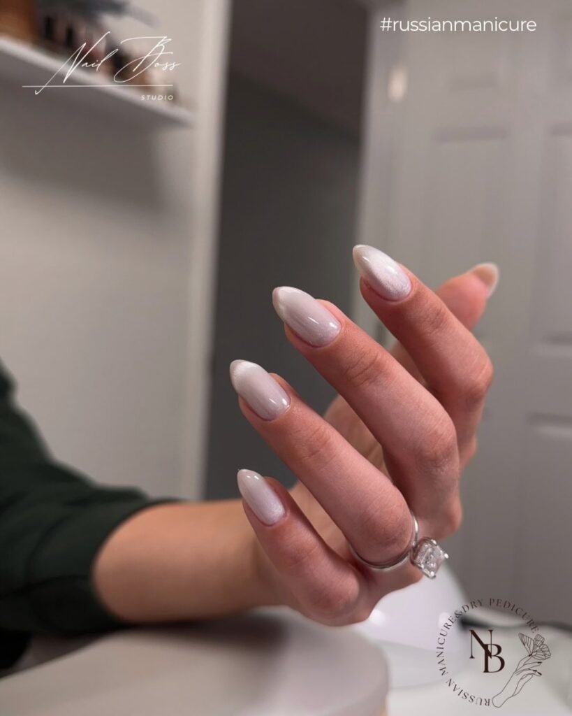 Elegant russian manicure on almond-shaped nails with soft glossy finish in Tampa, Florida