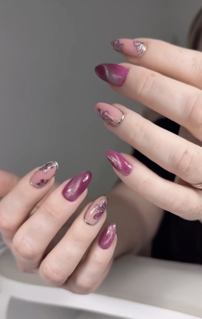 Elegant russian manicure in Tampa with pink shimmer nails and delicate butterfly nail art