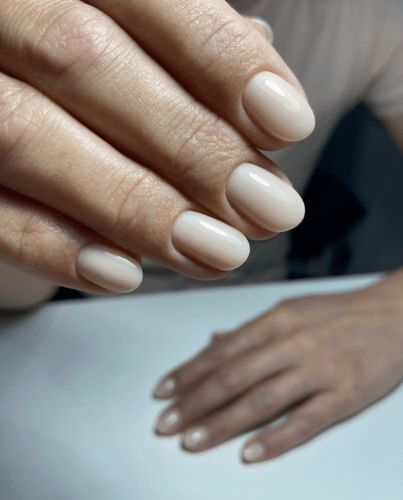 Natural soft nude russian manicure on short oval nails in Tampa, Florida