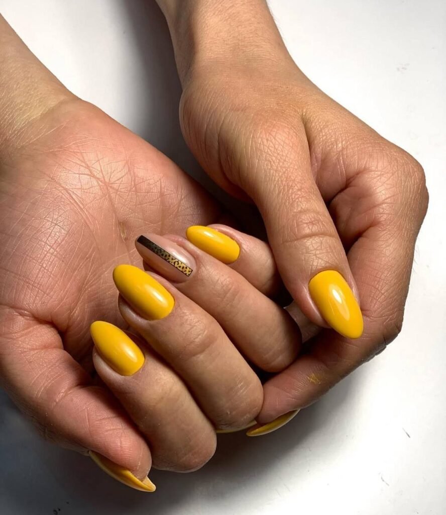 Bright yellow glossy nails russian manicures near me in Tampa Florida with clean cuticle work and almond shape