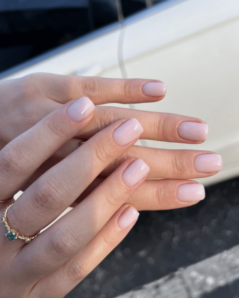 Soft natural pink nails with russian manicures Tampa style under sunlight in Tampa Florida