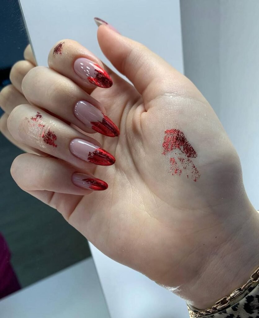 Elegant almond nails with nude base and red chrome tips, russian manicures Tampa style, clean luxury look in Tampa