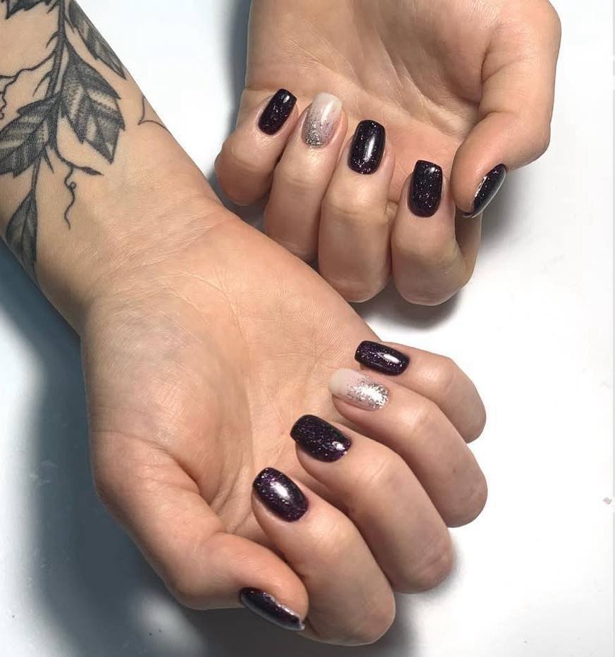 Elegant dark glitter manicure at russian nail salon in Tampa, Florida with detailed cuticle work
