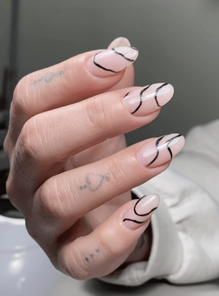 Minimalist nude russian nails with black abstract lines in Tampa, Florida