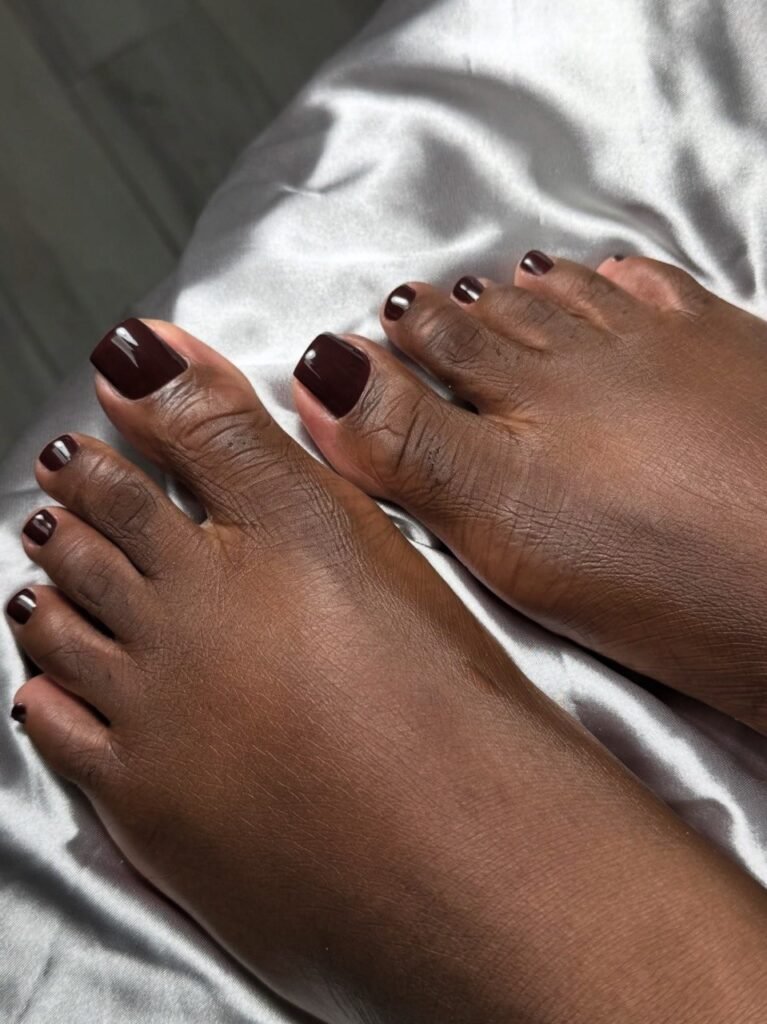 Smart pedicure tampa with deep burgundy gel polish on well-groomed toes in Tampa Florida