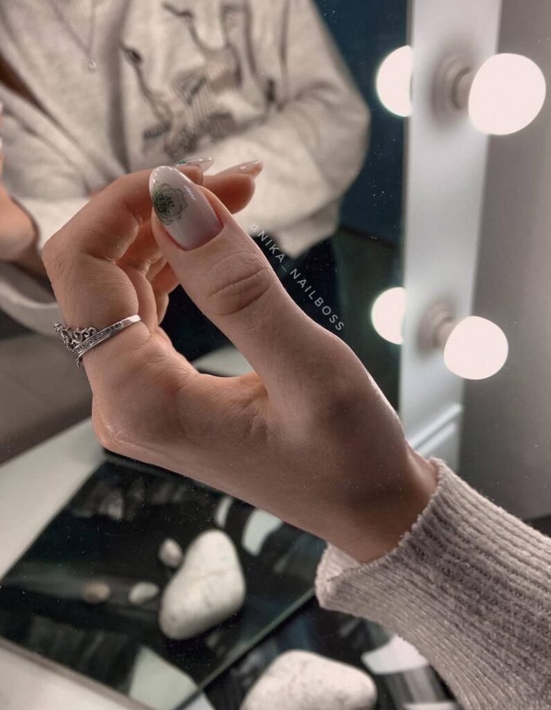 Elegant tampa russian manicure with soft nude color and floral detail in Tampa, Florida