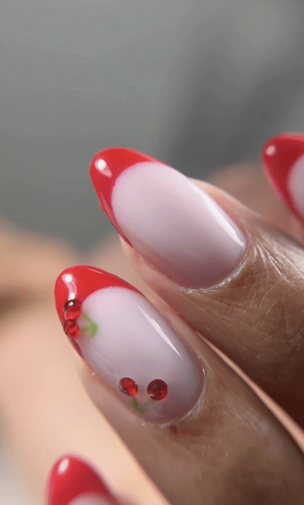 Close-up of Tampa Russian nails with glossy red French tips and soft pink base in Tampa