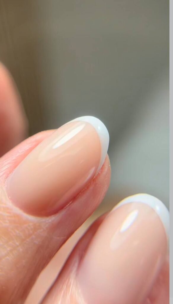 Elegant dry manicure with glossy nude French nails at Nail Boss Studio Tampa, Florida.