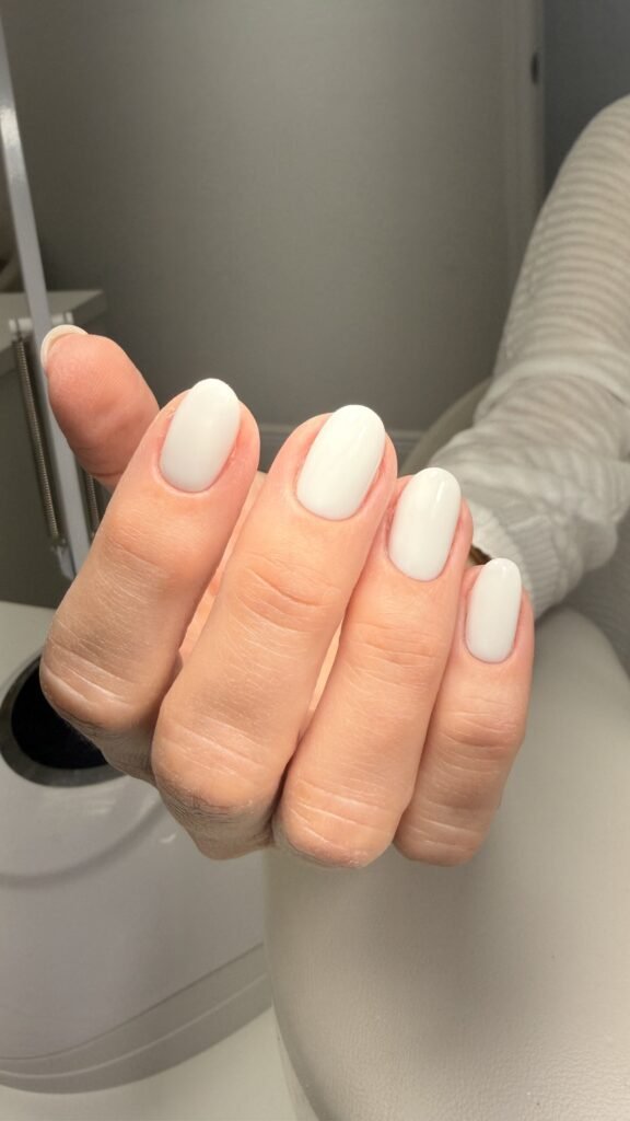 Soft neutral european manicure with almond nails at Nail Boss Studio Tampa, Florida.