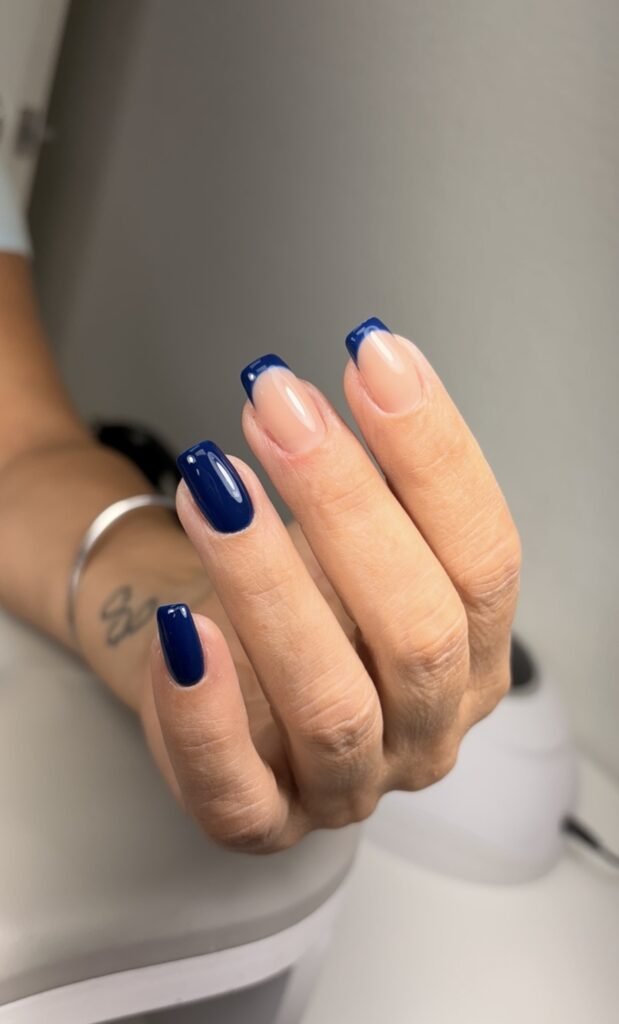 Elegant russian manicure Tampa with glossy navy French tips at Nail Boss Studio in Tampa, Florida.