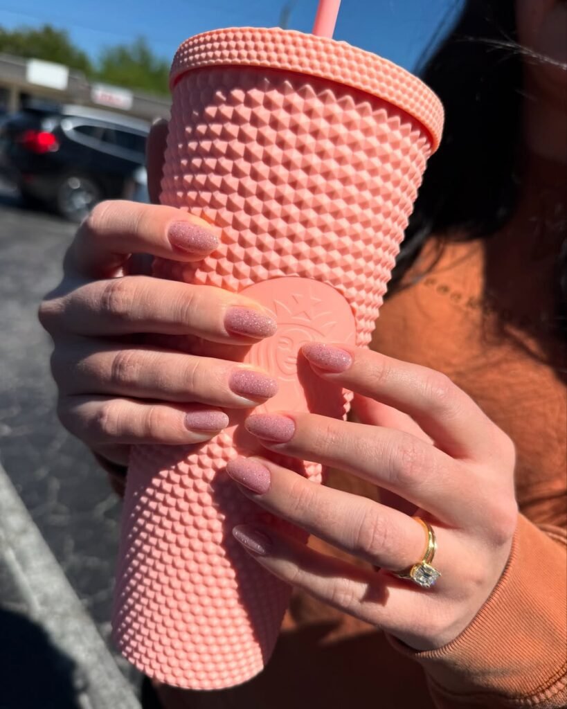 Soft pink shimmer russian manicure near me with elegant almond-shaped nails in Tampa, Florida at Nail Boss Studio.