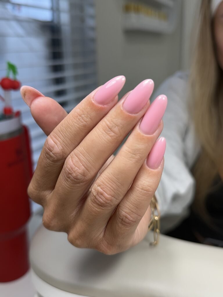 Soft pink european manicure with almond-shaped nails at Nail Boss Studio Tampa, Florida.