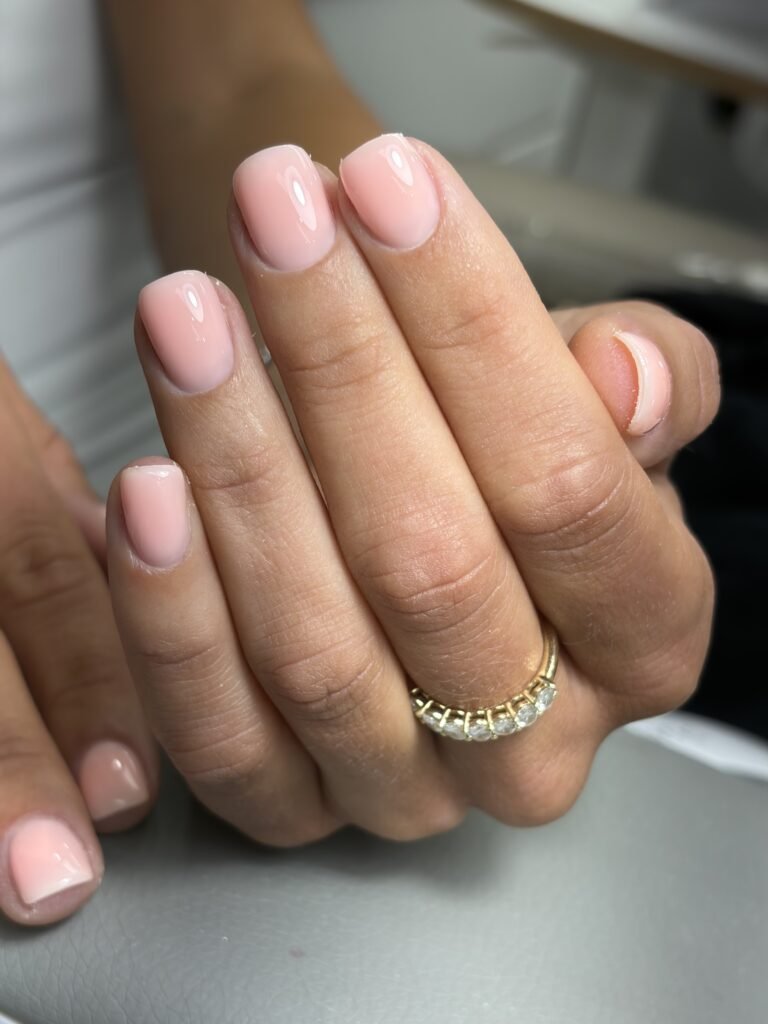 Soft blush manicure at a russian manicure salon in Tampa, Florida with glossy natural nails by Nail Boss Studio.